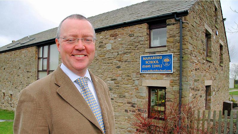 2. Derek outside school.JPG - Head Teacher Derek Cassells outside the award-winning Maharishi School in Skelmersdale, Lancashire, England